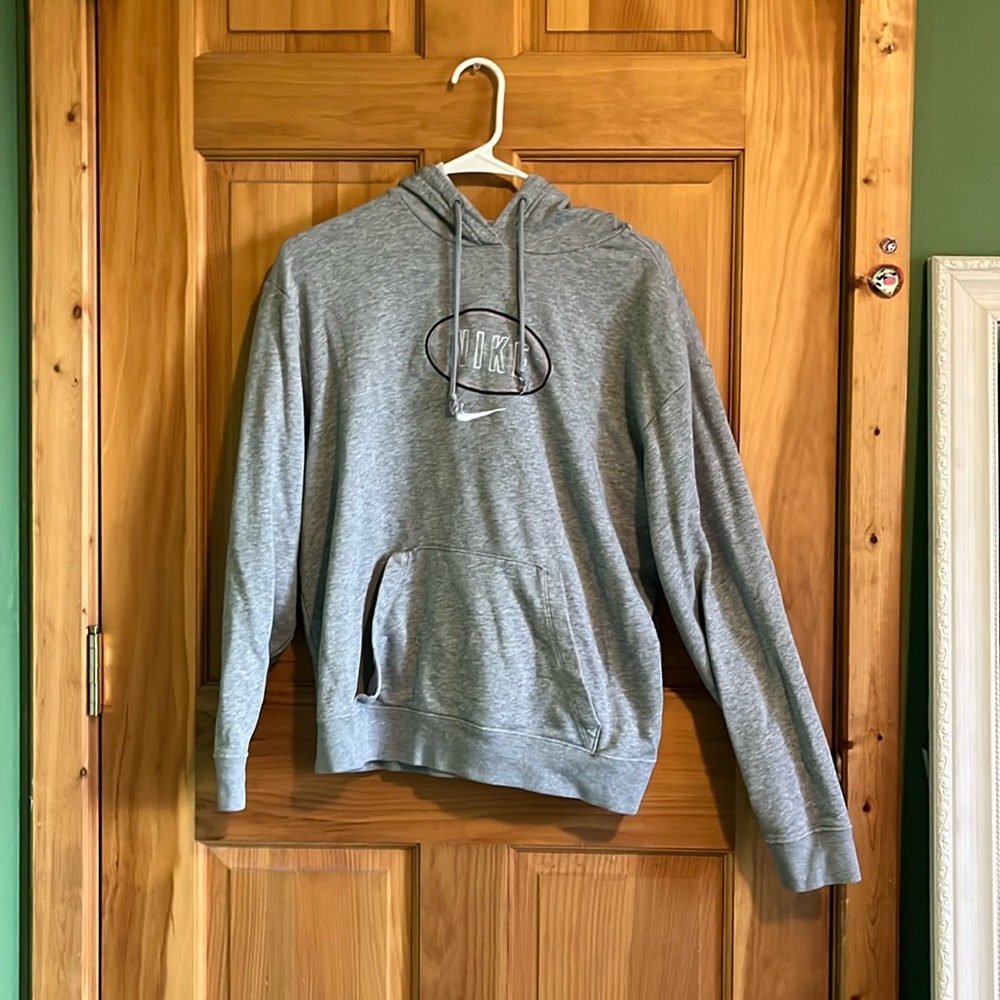 Grey Nike hoodie with pink, white, and black detail
